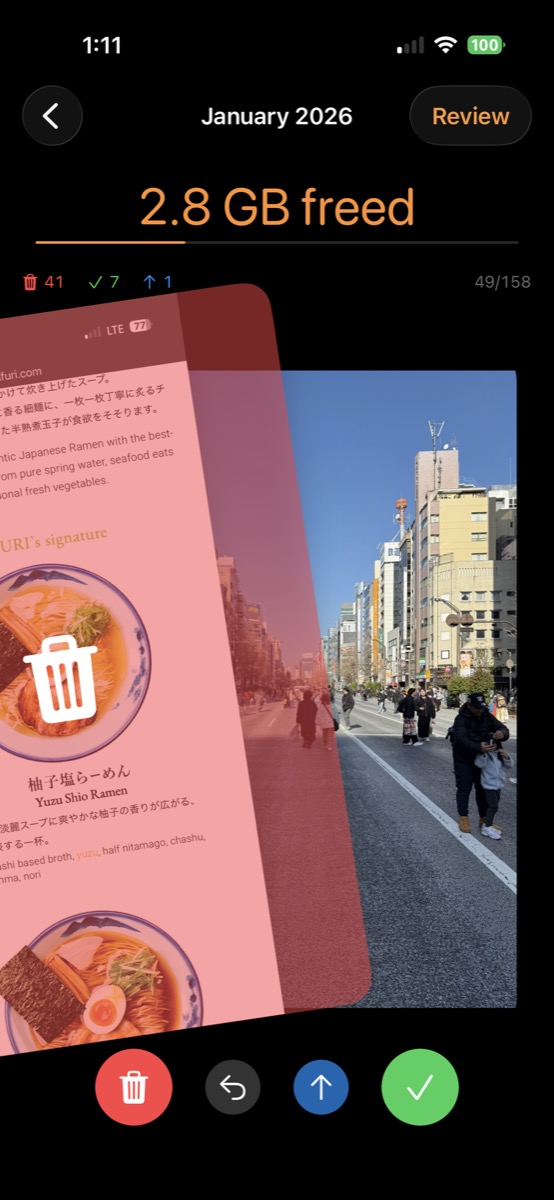 SwipeClean app showing the swipe interface with 2.8 GB freed